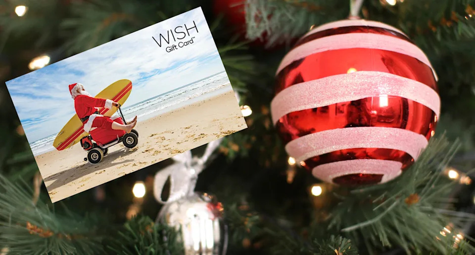 A decoration on a Christmas tree with an inset of a WISH gift card.