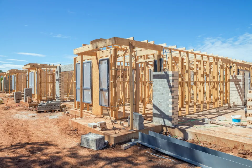 New suburban homes currently under construction in row