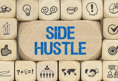 Wooden blocks with icons and text side hustle representing extra income ideas, Shartru Wealth Management.