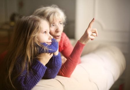 Shartru Wealth grandmother and child looking out window discussing superannuation death benefit.
