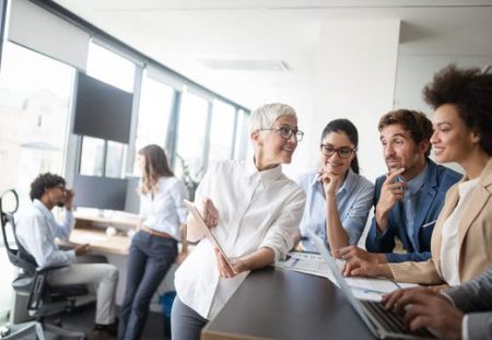 Shartru Wealth Management explains contribution eligibility and work test conditions to diverse office team.