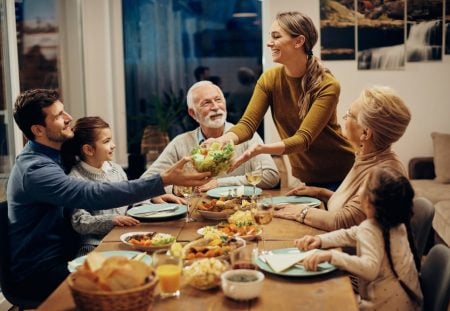 Shartru Wealth family sharing dinner together after adult children move back home.