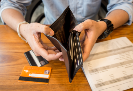 Man Holding An Empty Wallet