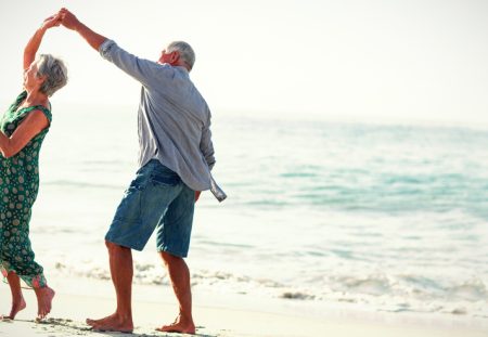 A Shartru Wealth photo shows a person reaching for a calendar with a retirement date circled.
