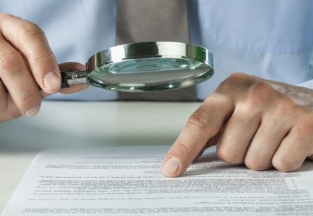 hartru Wealth Management tips for reviewing annual superannuation statements with magnifying glass detail.